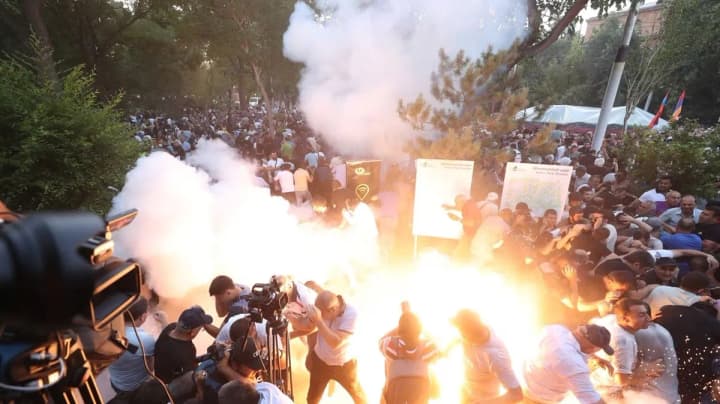Armenian police use stun grenades against protesters demanding the resignation of the government