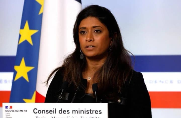 A government spokesman is attacked during an election rally in France