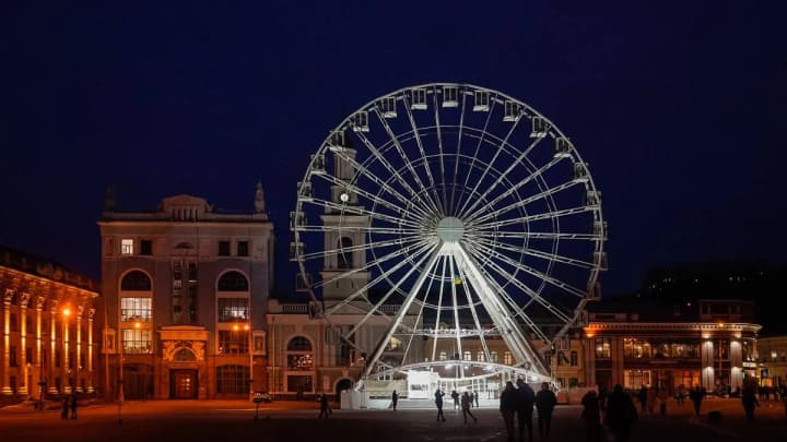 Kyiv law enforcement officers check the Ferris Wheel in Podil after a cable break on the cable car