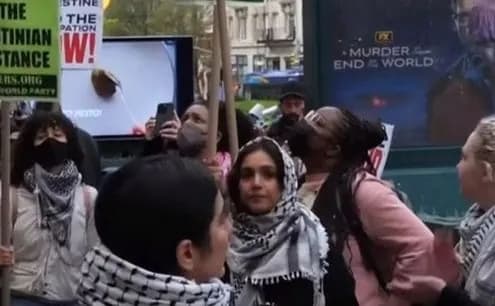 Protesters break through the barricade at the US Democratic Party convention