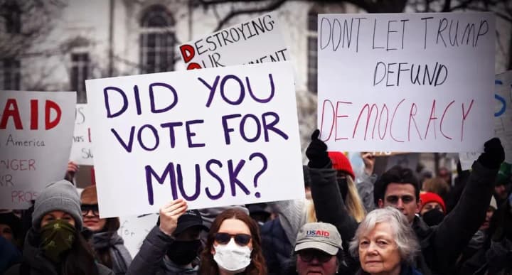 Hundreds of Americans take to the streets in the cold to protest Trump and Musk