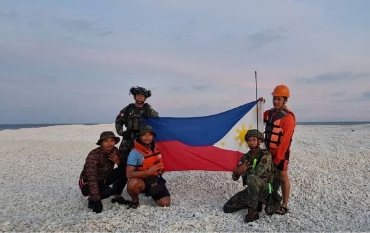 The Philippines landed on three islands disputed with China in response to Beijing's actions