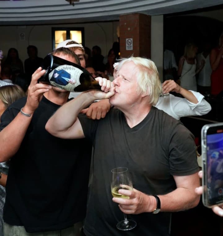 Boris Johnson drank champagne from the bottle and sang on the table during a party in Capri
