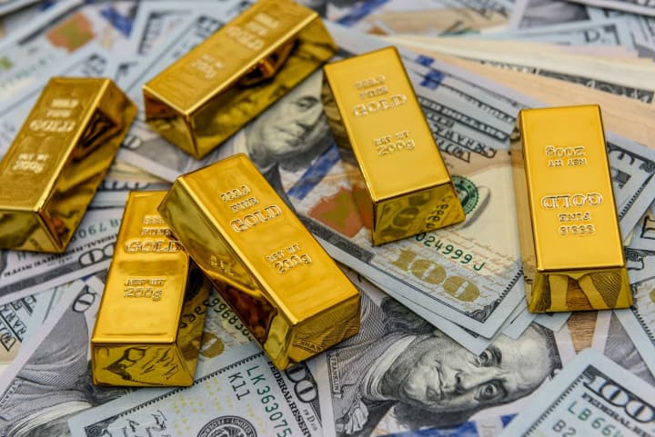 Gold hits weekly high after Fed signals possible December rate cut