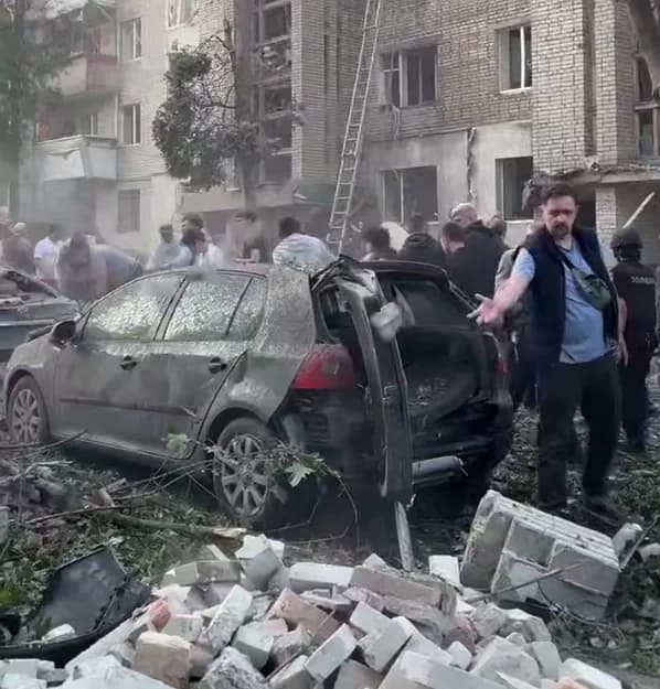 People remain under the rubble of a building in Lviv, residents help rescuers - Sadovyi