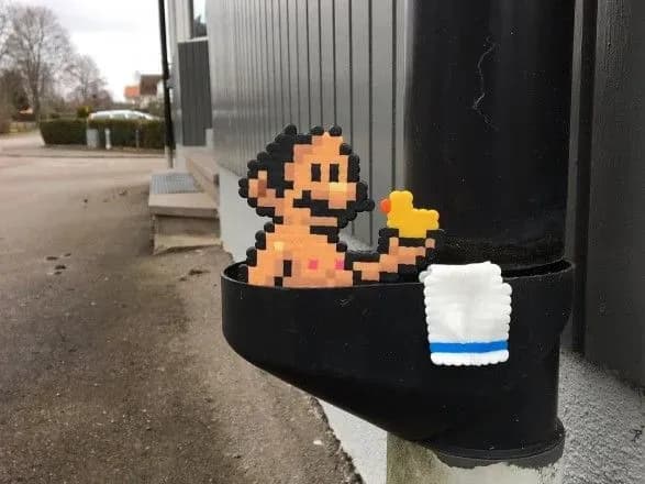 khudozhnik-zi-shvetsiyi-prikrashaye-mista-pikselnimi-kartinami