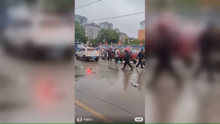 car-crashes-into-crowd-near-school-in-china-students-injured
