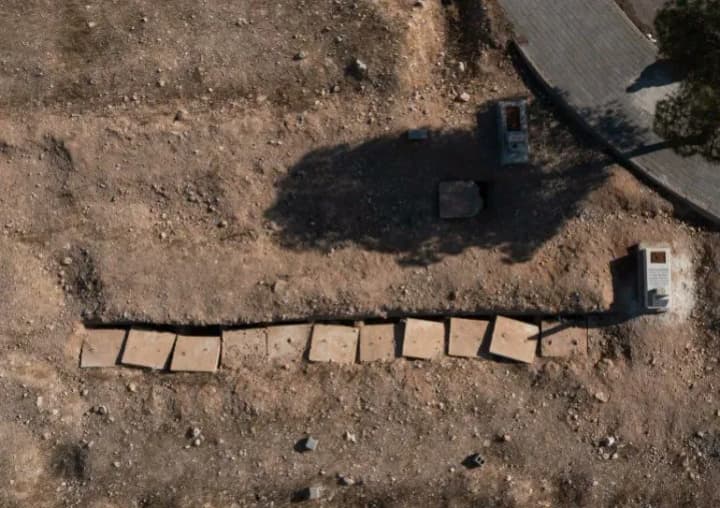 reuters-human-rights-activist-says-at-least-100000-bodies-in-syria-mass-grave