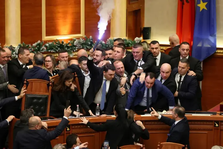 Albanian Parliament turns into a battlefield: flares, bottles, and accusations of falsification