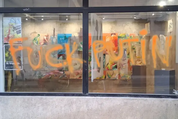 In Paris, unknown individuals vandalized a gallery where Putin's alleged daughter works and wrote "F*ck Putin" on the display window
