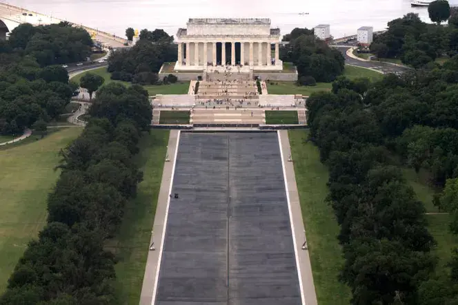 In the US, charges of vandalism against an Olympian for damaging the Reflecting Pool have been dropped