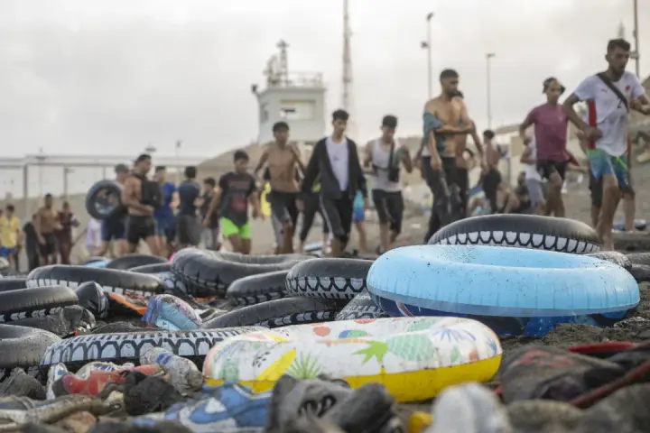 Near the border with Ceuta, hundreds of Moroccans are searching for missing relatives after a mass crossing into Spain