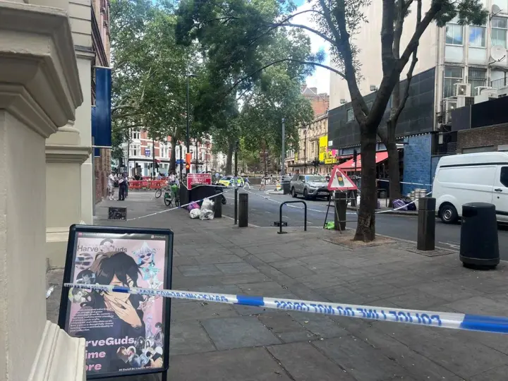 In London, a woman with scissors injured four men; she was detained
