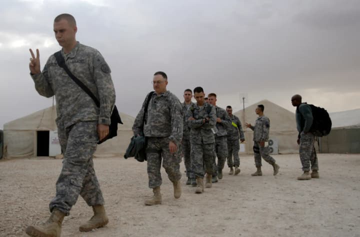 The United States will withdraw its remaining troops from Iraq by September 30, but pro-Iranian groups are refusing to disarm