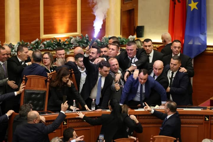 albanian-parliament-turns-into-a-battlefield-flares-bottles-and-accusations-of-falsification