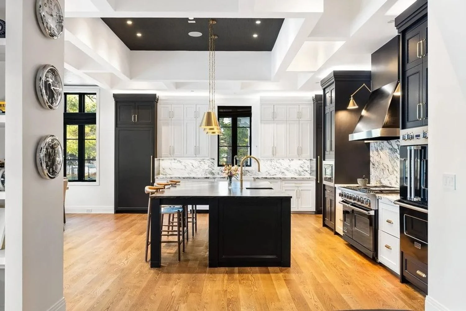 Luxurious kitchen with marble countertops and a large kitchen island with a sink. Realtor.com