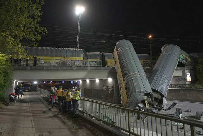 Freight train falls from bridge in Germany